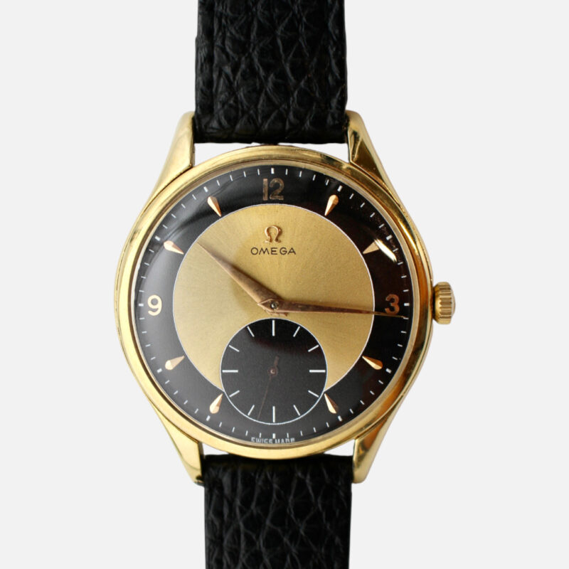 Vintage Omega Gold watch on black leather strap. The watch has a bullseye dial.