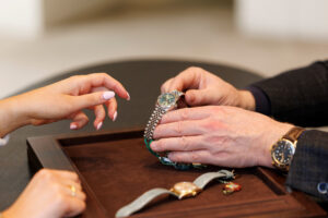 A lady shopping for preowned Rolex watches
